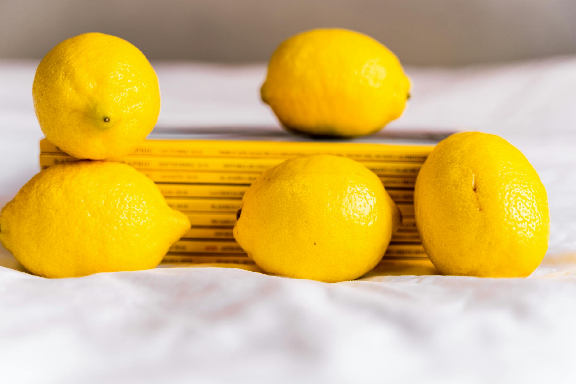 Close-up of hands holding a blue silicone personal massager against a knitted sweater